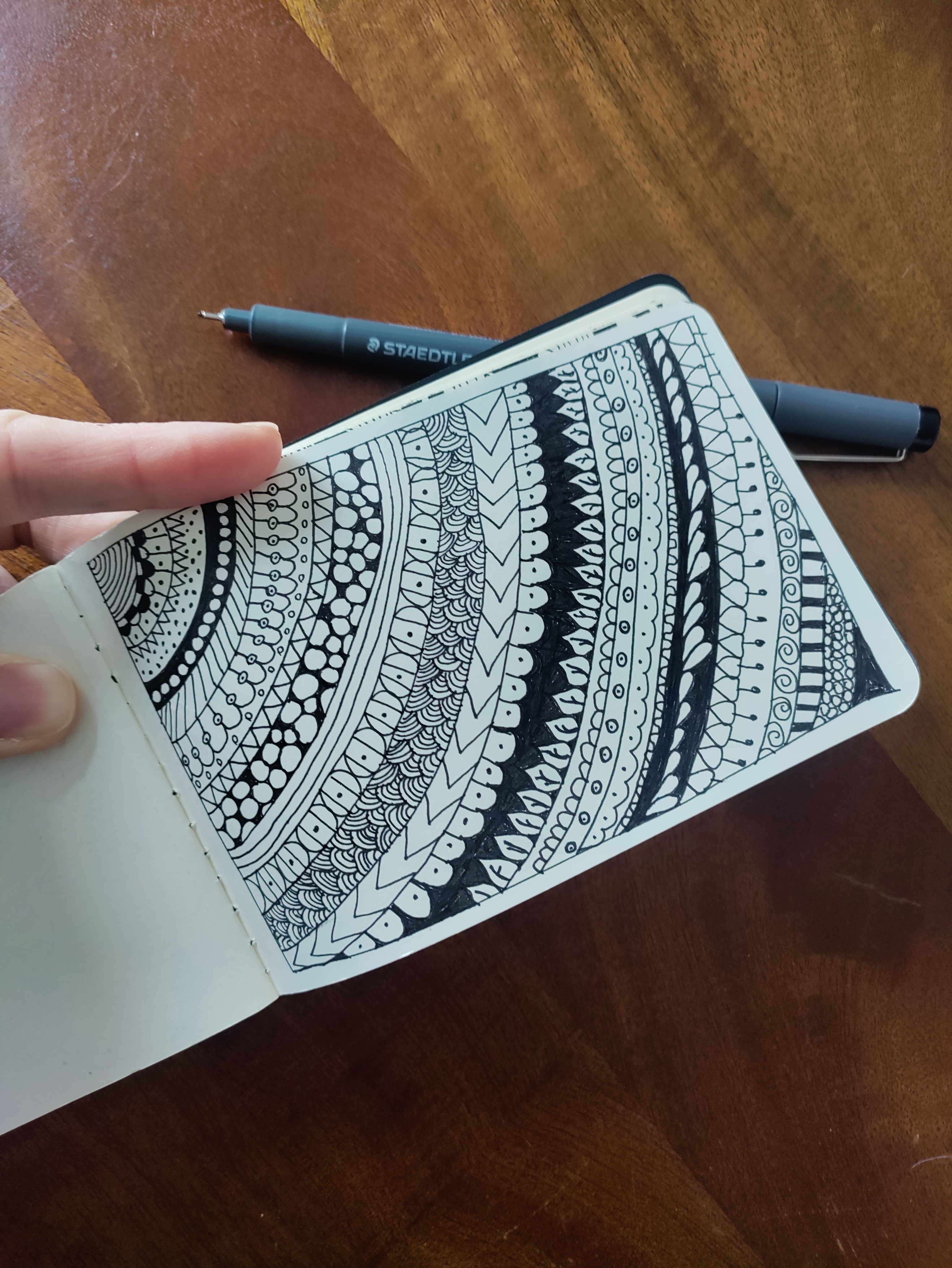 A notebook open with doodles